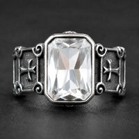 Bague Croisée de Lumière en acier inoxydable avec pierre blanche rectangulaire et croix latérales