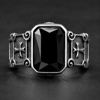 Bague Croisée de Lumière en acier inoxydable avec pierre noire rectangulaire et croix latérales