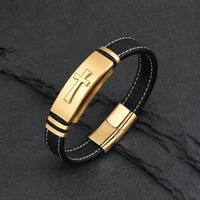 Bracelet de la Croix Sacrée en cuir véritable noir avec acier inoxydable doré sur fond anthracite texturé
