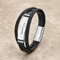 Bracelet de la Croix Sacrée en cuir véritable noir et acier inoxydable argenté sur pierre médiévale claire