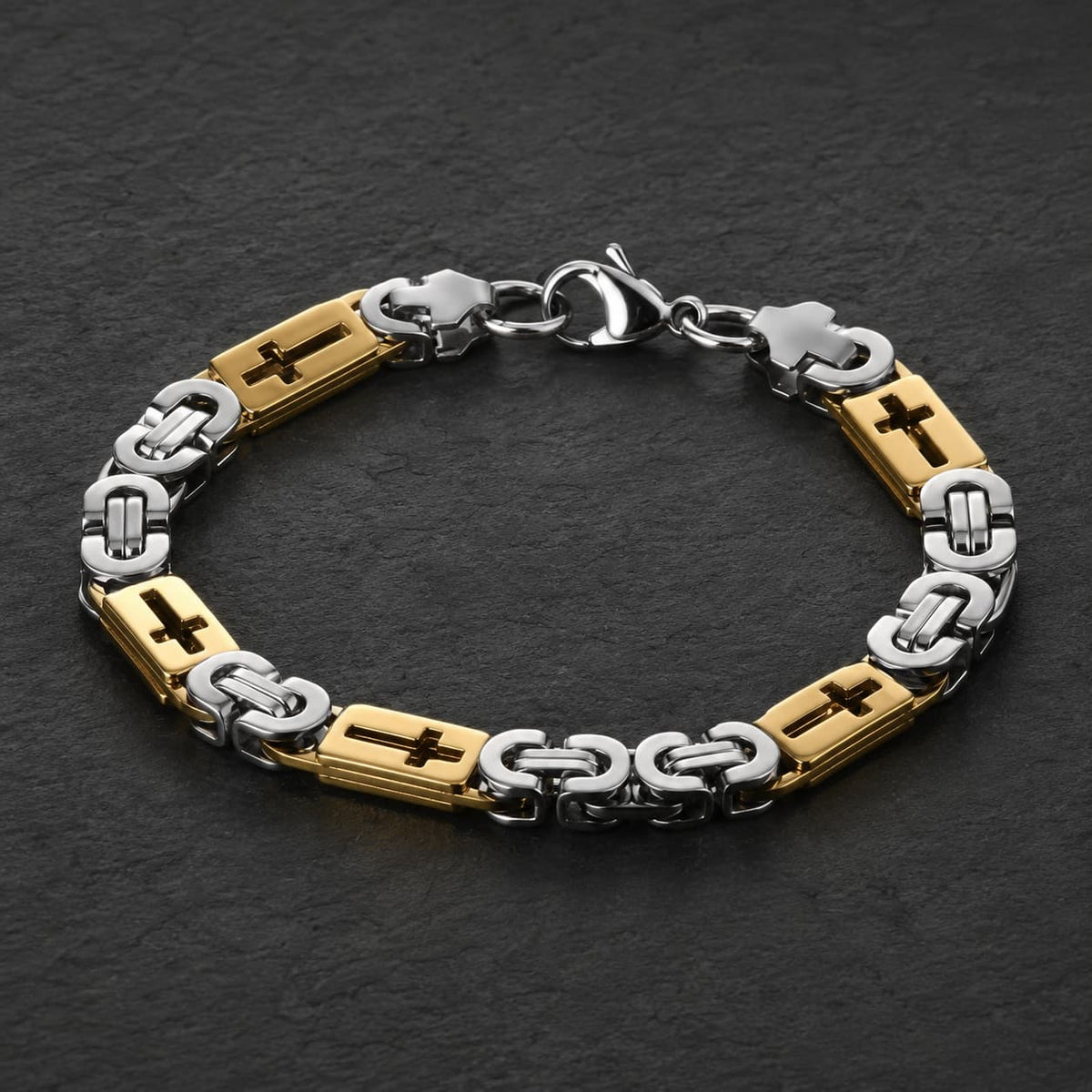 Bracelet de l’Espoir Croisé en acier inoxydable couleur or et argent sur ardoise sombre