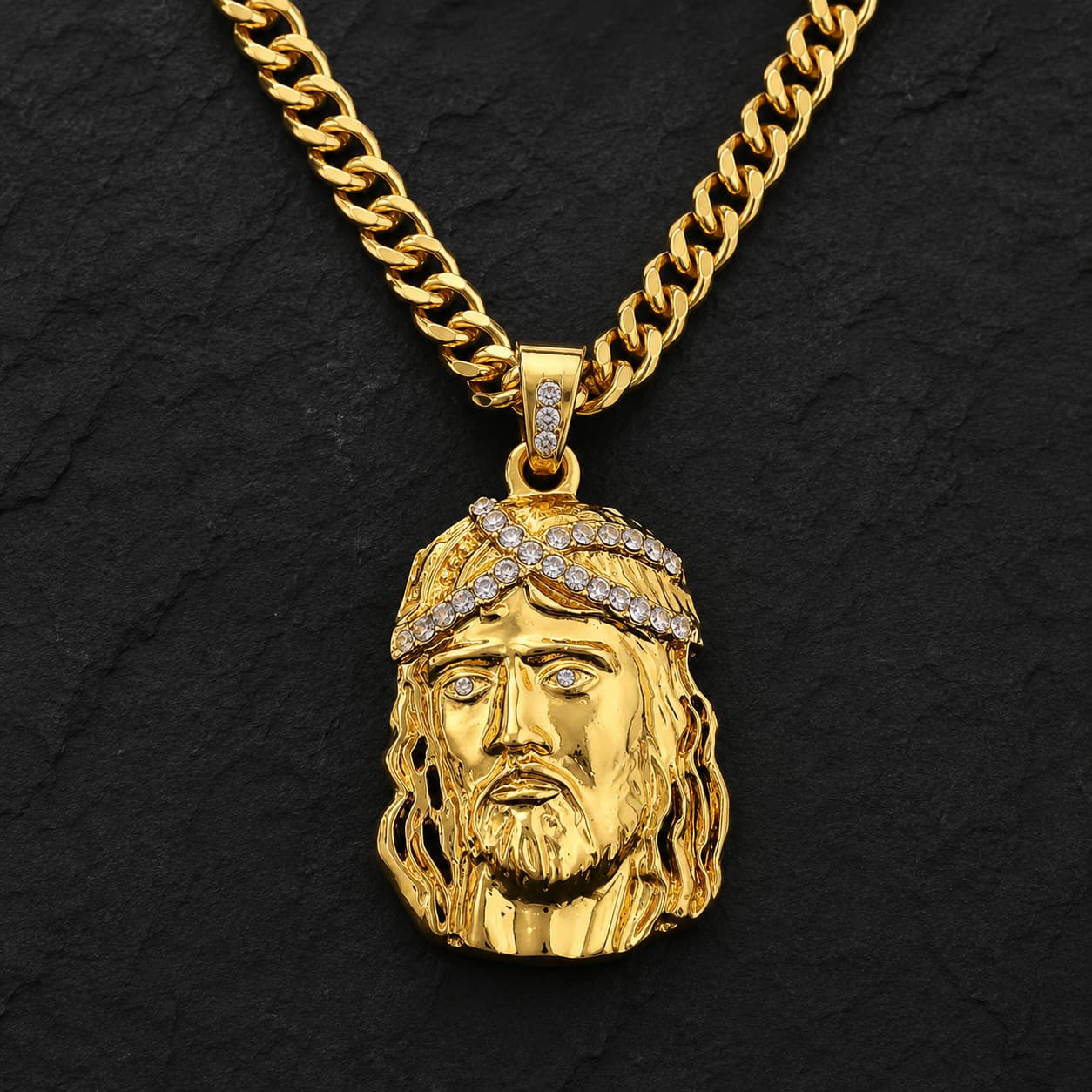 Collier de la Foi du Christ en acier inoxydable doré sur fond anthracite texturé ardoise sombre