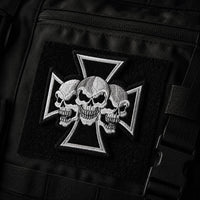 Écusson de l’Exécuteur en tissu brodé fixé sur un sac tactique noir.