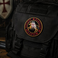 Patch Écusson de l’Exécuteur en tissu brodé fixé sur un sac tactique noir.